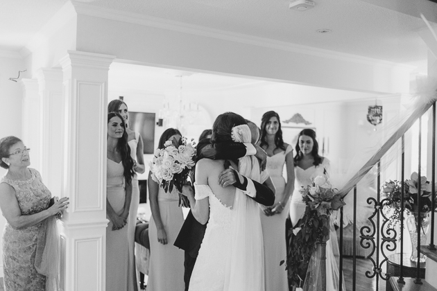 Father hugging his daughter on a wedding day