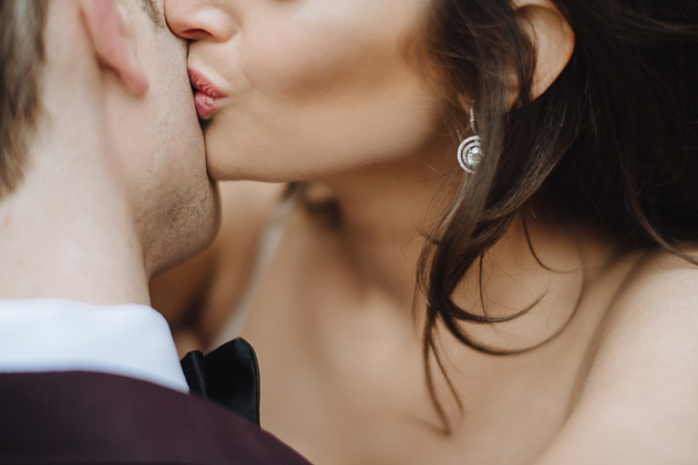Fermenting Cellar Toronto Wedding Photographer. A close up photo of the bride kissing her groom's cheek.