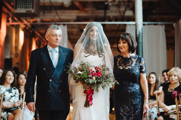 Fermenting Cellar Toronto Wedding Photographer. The parents walk the veiled bride down the aisle to her groom.