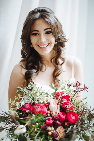 Fermenting Cellar Toronto Wedding Photography. Creative portrait photography session with the smiling bride and her wild romantic bouquet.