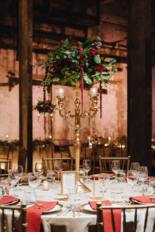 Fermenting Cellar Toronto Wedding Photographer. Idustrial chic and romantic wedding venue with exposed structural beams. Gold, peach and red accents colour the guest tables.