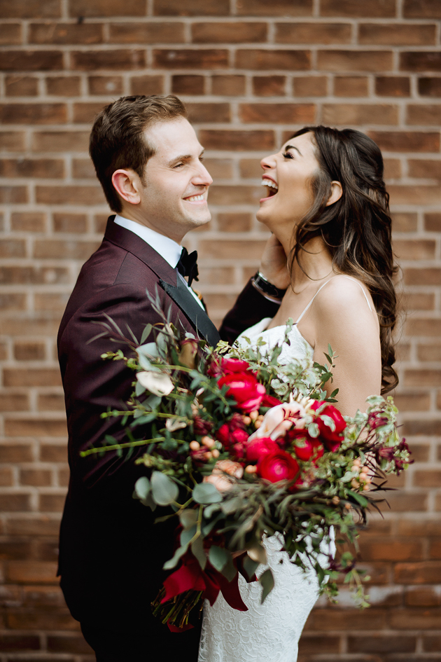 Fermenting Cellar Toronto WeddingFermenting Cellar Toronto Wedding. Outdoor creative portrait session with the bride and groom in the Distillery District captured here sharing a laugh against a brick wall backdrop.