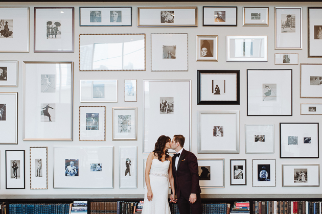 Fermenting Cellar Toronto Wedding Photography. Creative portrait photography of bride and groom against a beautifully styled gallery wall.