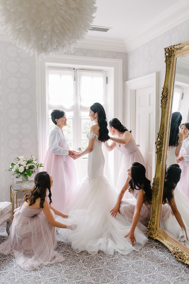 Bride getting ready at the Graydon Hall Manor / wedding photography cost